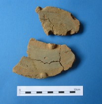 Fragments of clay object.
