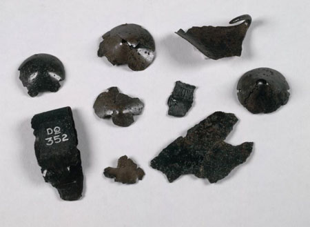 Fragments of cones and stripes made from bronze.