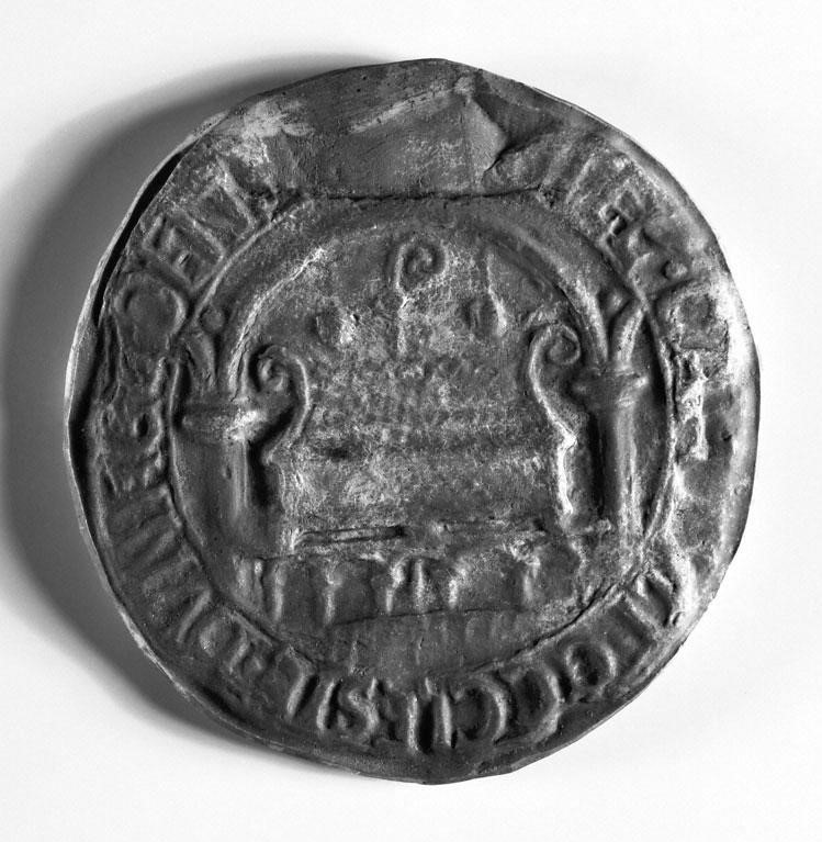 Marquise shaped lead seal, which resembles a coin and is stamped with words and a scene of a praying man at the bottom, with a large man and kneeling person at the top. 