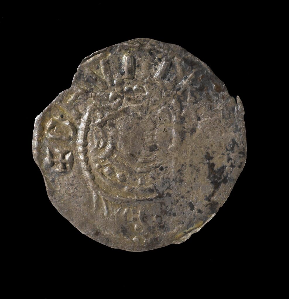 Silver coin on black background