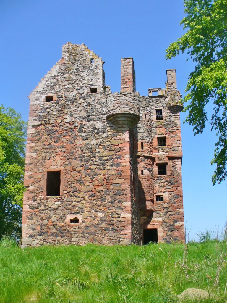 Photograph of tower against blue sky 