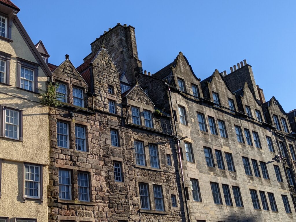 Photograph of upper storeys of tenement buildings