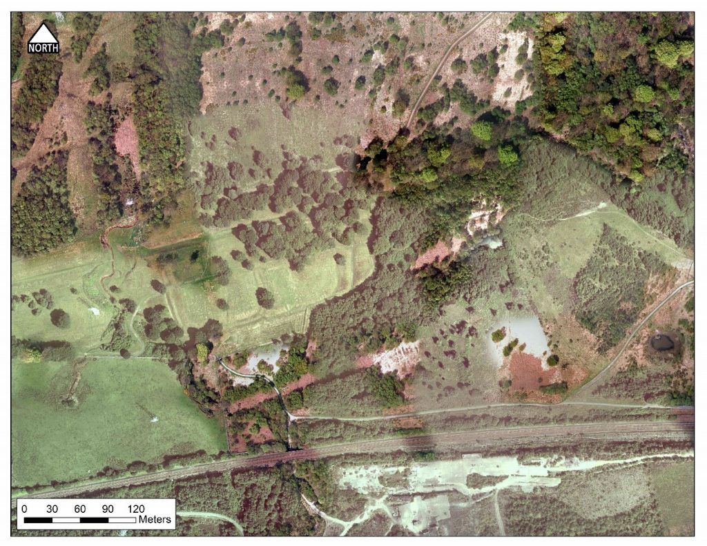 Aerial view of fort amongst trees and fields