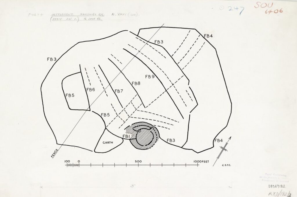Digital plan drawing showing features in solid and dotted black lines, with some pencil scribbles on the paper. 