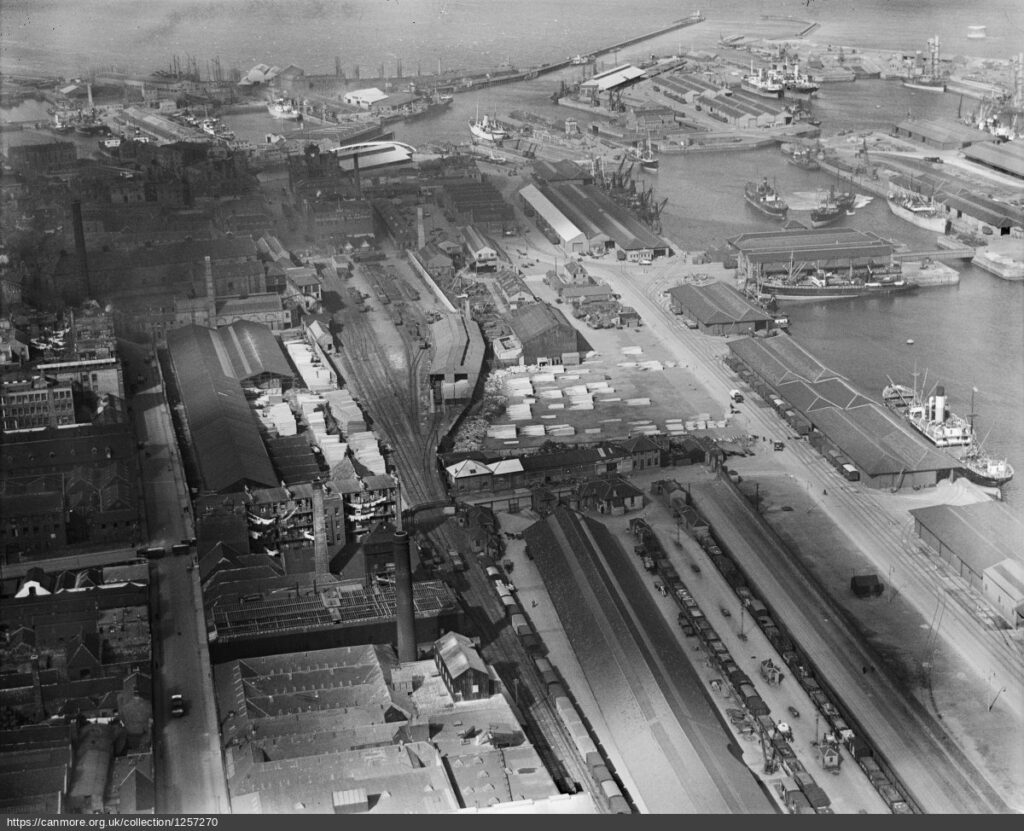 black and white aerial image ofglas works and three cones
