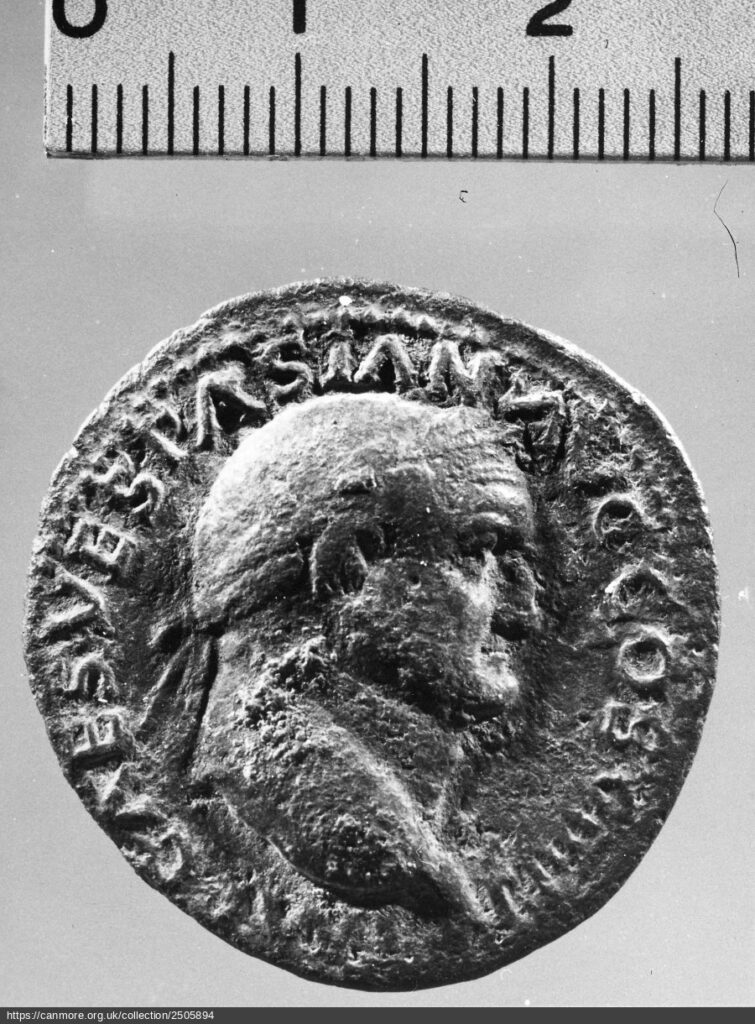 Photograph of coin in black and white with Vespasian's portrait