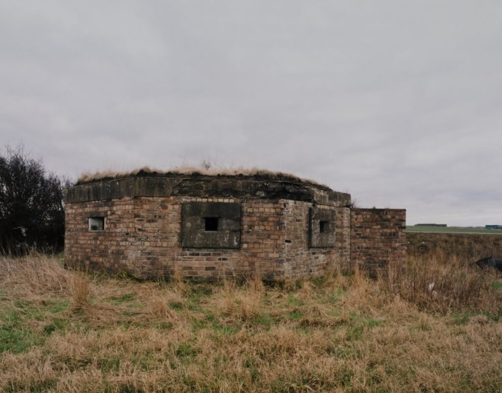 Photograph of pill box in a field