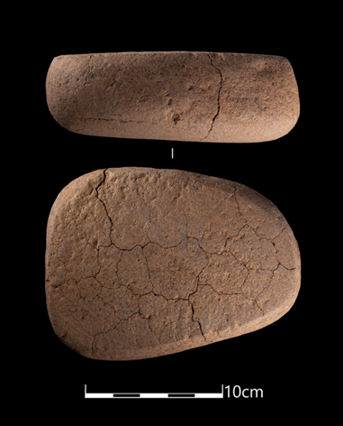 Photograph of quern side view and front, on black background