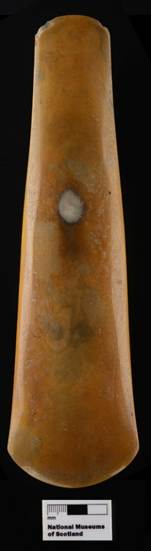 Photograph of flint from front view on black background