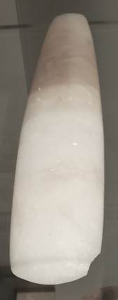 White chisel photographed in glass cabinet on display