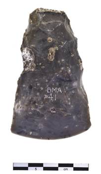 Photograph of front view of flint on white background