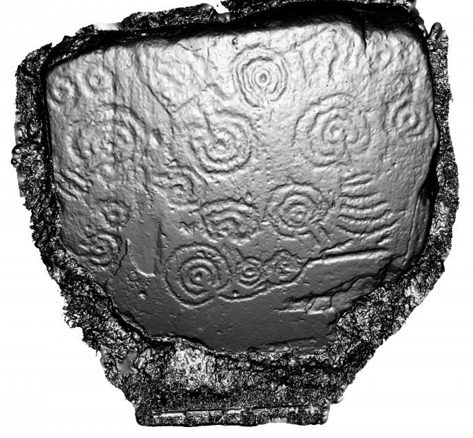 A grey, 3D model of the face of an irregular shaped stone with circular and curved line carvings. 