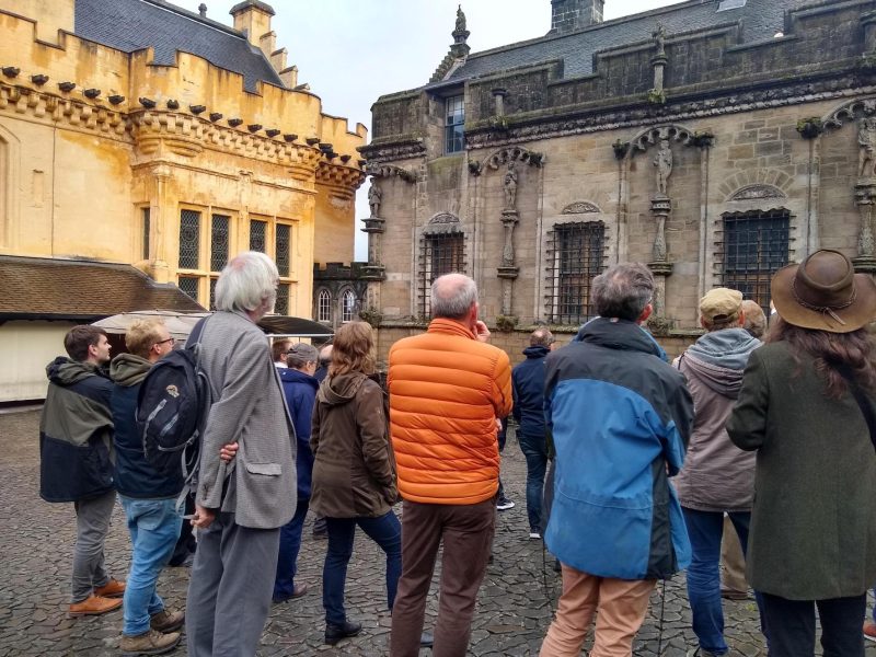 260715_S_RoyalPalaceGreatHallStirlingCastle A crowd of people look towards stone buildings